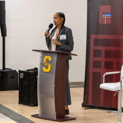wendy-speaking-at-event-school-podium